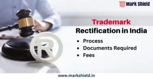a image person hand holding gavel in heand and written over trademark rectification in India