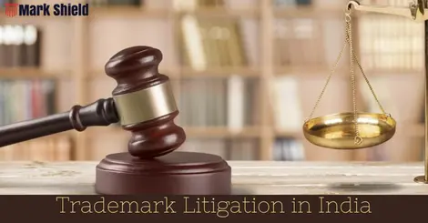 "A gavel sits on a desk with the words 'Trademark Litigation' written on it, representing the legal system in India